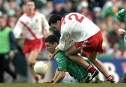 17 March 2004; Noel Meehan of Caltra in action against Sean Mac Sithigh of An Gaeltacht during the AIB All-Ireland Senior Club Football Championship Final between An Gaeltacht and Caltra at Croke Park in Dublin. Photo by Brendan Moran/Sportsfile