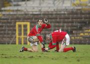 11 March 2007; Billy Joe Padden, Mayo, calls on the referee to delay the game as his team-mate Enda Devenney ties his laces. Allianz National Football League, Division 1A Round 4, Fermanagh v Mayo, St Tighearnach's Park, Clones, Co. Monaghan. Picture credit: Ray McManus / SPORTSFILE