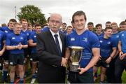 27 September 2014; Leinster captain Conor Farrell is presented with the cup by Des Kavanagh, IRFU. Under 18 Club Interprovincial, Munster v Leinster. Waterpark RFC, Waterford. Picture credit: Ramsey Cardy / SPORTSFILE