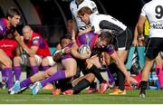 27 September 2014; Stuart McCloskey, Ulster, is tackled by Kelly Haimona, Zebre. Guinness PRO12, Round 4, Zebre v Ulster. Stadio XXV Aprile, Parma, Italy. Picture credit: Roberto Bregani / SPORTSFILE