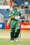 15 March 2007; Ireland batsman William Porterfield makes his way back to the pavillion after being caught by Uuisimuli Sibanda, Zimbabwe. ICC Cricket World Cup, Group D, Ireland v Zimbabwe, Sabina Park, Kingston, Jamaica. Picture credit: Pat Murphy / SPORTSFILE