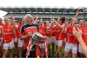 28 September 2014; Cork manager Eamon Ryan and the team celebrate with the Brendan Martin Cup after the game. TG4 All-Ireland Ladies Football Senior Championship Final, Cork v Dublin. Croke Park, Dublin. Picture credit: Brendan Moran / SPORTSFILE