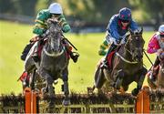 4 October 2014; Bay Hill, left, with jockey Jody McGarvey up, jumps the last on the way to winning the Golf Memberships 2015 From €749 3-Y-O Hurdle from second place Batchelors Walk, with Paul Townend up. Gowran Park, Gowran, Co. Kilkenny. Picture credit: Matt Browne / SPORTSFILE