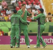 3 April 2007; Ireland bowler Boyd Rankin, centre, celebrates with team-mates Nial O'Brien, left, and William Porterfield after Andrew White had caught out South Africa's Herschelle Gibbs off his delivery. ICC Cricket World Cup 2007, Super 8, Ireland v South Africa, Guyana National Cricket Stadium, Georgetown, Guyana. Picture credit: Pat Murphy / SPORTSFILE