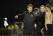 10 October 2014; Dundalk manager Stephen Kenny instructs Dane Massey to put on a replacment jersey. SSE Airtricity League Premier Division, Athlone Town v Dundalk. Athlone Town Stadium, Athlone, Co. Westmeath. Picture credit: David Maher / SPORTSFILE