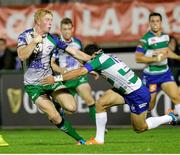 10 October 2014; Darragh Leader, Connaught, is tackled by Jayden Hayward, Benetton Treviso. Guinness PRO12, Round 6, Benetton Treviso v Connacht. Stadio Comunale di Monigo, Treviso, Italy. Picture credit: Roberto Bregani / SPORTSFILE