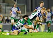 10 October 2014; Darragh Leader, Connaught, is tackled by Enrico Bacchin, Benetton Treviso. Guinness PRO12, Round 6, Benetton Treviso v Connacht. Stadio Comunale di Monigo, Treviso, Italy. Picture credit: Roberto Bregani / SPORTSFILE