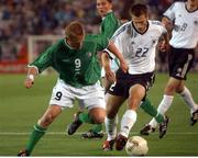 5 June 2002; Damien Duff, Republic of Ireland, is tackled by Torsten Frings, Germany. FIFA World Cup Finals, Group E, Republic of Ireland v Germany, Ibaraki Stadium, Ibaraki, Japan. Picture credit: David Maher / SPORTSFILE
