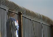 8 April 2007; A young Laois fan watches the match through a fence. Allianz National Football League, Division 1B, Round 7, Kildare v Laois, St. Conleth's Park, Newbridge, Co. Kildare. Picture credit: Brian Lawless / SPORTSFILE