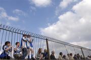 8 April 2007; Football fans watch the match through a fence. Allianz National Football League, Division 1B, Round 7, Kildare v Laois, St. Conleth's Park, Newbridge, Co. Kildare. Picture credit: Brian Lawless / SPORTSFILE