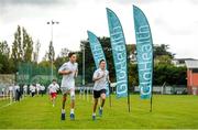 15 October 2014; Today GloHealth launched their School Mile Challenge to help children become more active and improve their fitness during school. Robert Cullen, left, aged 13, and Zack Deaney, aged 12, in action during the first race of the day. GloHealth School Mile Challenge. St. Colmcilles Community School, Knocklyon, Dublin. Picture credit: Barry Cregg / SPORTSFILE