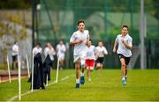 15 October 2014; Today GloHealth launched their School Mile Challenge to help children become more active and improve their fitness during school. Robert Cullen, left, aged 13, and Zack Deaney, aged 12, in action during the first race of the day. GloHealth School Mile Challenge. St. Colmcilles Community School, Knocklyon, Dublin. Picture credit: Barry Cregg / SPORTSFILE