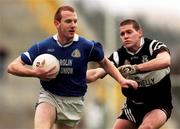 7 November 1999; Liam Hassett of Laune Rangers in action against Kieran Burns of Doonbeg during the AIB Munster Senior Club Football Championship semi-final match between Doonbeg and Laune Rangers at Fitzgerald Stadium in Killarney, Kerry. Photo by Ray Lohan/Sportsfile