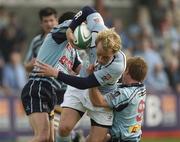 14 April 2007; Eoghan Hickey, Garryowen, is tackled by Gavin McLoughlin, left, and Paul Marshall, Belfast Harlequins. AIB Senior Cup Final, Garryowen v Belfast Harlequins, Dubarry Park, Athlone, Co. Westmeath. Picture credit; Matt Browne / SPORTSFILE