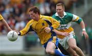 15 April 2007; Stuart Daly, Roscommon, in action against Neville Coughlan, Offaly. Allianz National Football League, Division 2A, Offaly v Roscommon, O'Connor Park, Tullamore, Co. Offaly. Picture credit; Brian Lawless / SPORTSFILE