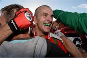 19 October 2014; John Miskella, Ballincollig, is congratuled by supporters after the game. Cork County Senior Football Championship Final, Ballincollig v Carbery Rangers, Pairc Ui Chaoimh, Cork. Photo by Sportsfile