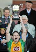 19 October 2014;  Michael Farragher, Corofin, lifts the Frank Fox cup. Galway County Senior Football Championship Final, Corofin v St Michael's, Tuam Stadium, Tuam, Co. Galway. Picture credit: Ray Ryan / SPORTSFILE