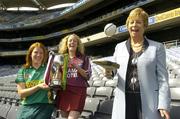 16 April 2007; Liz Howard, President of the Camogie Association, shows off her skills in front of Division 3 captains Aileen Donnelly, Meath, left, and Lorraine Leavey, Westmeath, at a photocall ahead of the Camogie Division 2 and 3 National League finals. Croke Park, Dublin. Picture credit: Pat Murphy / SPORTSFILE
