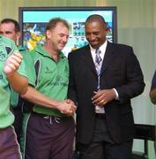 25 April 2007; Out-going coach Adrian Birrel, right, shakes hands with incoming coach Phil Simmons as he officialy stood down as team coach at the official welcome home reception for the Ireland cricket team. Shelbourne Hotel, St. Stephen's Green, Dublin. Picture credit: Pat Murphy / SPORTSFILE