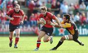 28 April 2007; Tomas O'Leary, Munster, is tackled by Robert Sidoli, Newport Gwent Dragons. Magners League, Munster v Newport Gwent Dragons, Musgrave Park, Cork. Picture credit: Brendan Moran / SPORTSFILE