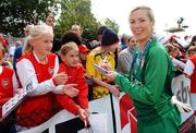 29 April 2007; Arsenal goalkeeper Emma Byrne signs autographs for fans after the match. 2006/07 UEFA Women's Cup Final 2nd Leg, Arsenal v Umeå IK, Boreham Wood Football Club, Hertfordshire, UK. Picture credit: Brian Lawless / SPORTSFILE