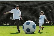 30 April 2007; Pictured at the launch of the 2007 Danone Nations Cup are Irish &quot;Godfather&quot; Denis Irwin, ex Republic of Ireland soccer international, and Brian Gleeson, aged 7, from Dublin. The national finals are due to take place here at the AUL Complex, Clonshaugh, Dublin on the 27th May 2007. AUL Complex, Clonshaugh, Dublin. Picture credit: David Maher/ SPORTSFILE