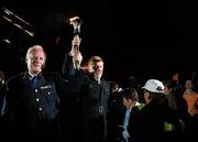 29 April 2007; Guardians of the 'Flame of Hope' Deputy Commissioner Peter Fitzgerald of An Garda Siochana, left, and ACC Duncan McCausland of the PSNI carry in the Special Olympics torch at the Team Ireland announcement for the 2007 Special Olympics World Summer Games. The World Summer Games will be held in The People's Republic of China, in the city of Shanghai from the 2nd October to the 11th October 2007. RDS, Dublin. Photo by Sportsfile