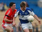 5 May 2007; Michael Tierney, Laois, in action against Kevin Harrington, Cork. Michael was awarded the Cadbury Hero of the Match Award. Michael is now shortlisted for the 2007 Cadbury Hero of the Future Award. Cadbury All-Ireland U21 Football Championship Final, Cork v Laois, Semple Stadium, Thurles, Co. Tipperary. Photo by Sportsfile