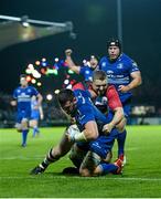 31 October 2014; Ben Marshall, Leinster, goes over for his side's fourth try despite the tackle of John Andress, Edinburgh. Guinness PRO12, Round 7, Leinster v Edinburgh. RDS, Ballsbridge, Dublin. Picture credit: Stephen McCarthy / SPORTSFILE