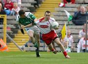 20 May 2007; Nial Gormley, Tyrone, held back by Shane Goan, Fermanagh. Bank of Ireland Ulster Senior Football Championship Quarter-Final, Fermanagh v Tyrone, St Tighearnach's Park, Clones, Co Monaghan. Picture credit: Oliver McVeigh / SPORTSFILE