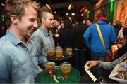 5 November 2014; Bar staff greet attendees inside the Jameson Popup bar, a butchers style shop, during the night summit following Day 2 of the 2014 Web Summit. Herbert Park, Dublin. Picture credit: Barry Cronin / SPORTSFILE / Web Summit