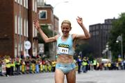 4 June 2007; Marie Davenport crosses the line to take victory in the Flora Women's Mini-Marathon. Dublin. Picture credit: Tomas Greally / SPORTSFILE