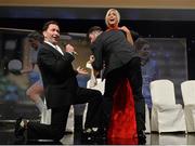 8 November 2014; Cork's Brid Stack with the Galway tenors during their performance at the TG4 Ladies Football All-Star Awards. TG4 Ladies Football All-Star Awards 2014, Citywest Hotel, Saggart, Co. Dublin. Picture credit: Brendan Moran / SPORTSFILE