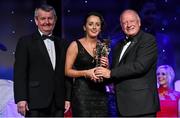 8 November 2014; Geraldine O'Flynn, Cork, is presented with her TG4 Ladies Football All-Star Award by Pat Quill, President of the Ladies Gaelic Football Association, in the company of Pól O Gallchóir, left, Ceannsaí, TG4. TG4 Ladies Football All-Star Awards 2014, Citywest Hotel, Saggart, Co. Dublin. Picture credit: Brendan Moran / SPORTSFILE