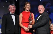 8 November 2014; Caroline O'Hanlon, Armagh, is presented with her TG4 Ladies Football Senior Players' Player of the Year by Pat Quill, President of the Ladies Gaelic Football Association, in the company of Pól O Gallchóir, left, Ceannsaí, TG4. TG4 Ladies Football All-Star Awards 2014, Citywest Hotel, Saggart, Co. Dublin. Picture credit: Brendan Moran / SPORTSFILE