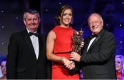 8 November 2014; Caroline O'Hanlon, Armagh, is presented with her TG4 Ladies Football All-Star Award by Pat Quill, President of the Ladies Gaelic Football Association, in the company of Pól O Gallchóir, left, Ceannsaí, TG4. TG4 Ladies Football All-Star Awards 2014, Citywest Hotel, Saggart, Co. Dublin. Picture credit: Brendan Moran / SPORTSFILE