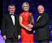 8 November 2014; Brid Stack, Cork, is presented with her TG4 Ladies Football All-Star Award by Pat Quill, President of the Ladies Gaelic Football Association, in the company of Pól O Gallchóir, left, Ceannsaí, TG4. TG4 Ladies Football All-Star Awards 2014, Citywest Hotel, Saggart, Co. Dublin. Picture credit: Brendan Moran / SPORTSFILE