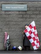 9 November 2014; Flag seller outside the ground ahead of the game. AIB Ulster GAA Football Senior Club Championship, Quarter-Final, Slaughtneil v Cavan Gaels, Owenbeg, Derry. Picture credit: Oliver McVeigh / SPORTSFILE