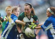 3 June 2007; &quot;Gearing Up for Cúl Camps&quot;. Pictured playing for the Vhi Cúl Camps Team in Croke Park on Sunday are Aisling Ni Riain, centre, Gaelscoil Taobh na Coille, Co. Dublin, in action against Melissa Nolan, left, and Micheala O'Rourke, Scoil Mhicil Naofa, Athy, Co. Kildare. Bank of Ireland Leinster Senior Football Championship, Meath v Dublin, Croke Park, Dublin. Picture Credit: David Maher / SPORTSFILE