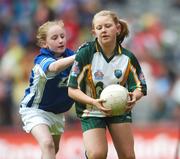 3 June 2007; &quot;Gearing Up for Cœl Camps&quot;. Pictured playing for the Vhi Cœl Camps team in Croke Park on Sunday are Erin Nic Dhomhnaill, right, Gaelscoil Taobh na Coille, Co. Dublin, in action against Maebh Molloy, Scoil Mhicil Naofa, Athy, Co. Kildare. Bank of Ireland Leinster Senior Football Championship, Meath v Dublin, Croke Park, Dublin. Picture Credit: David Maher / SPORTSFILE