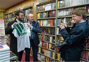 12 November 2014; Edward Gaffney, from Marino, Dublin, takes the picture of former Republic of Ireland international Alan McLoughlin, right, and Patrick Carroll, left, from Templeogue, Dublin, at the launch of  'A Different Shade of Green. Dubray Bookshop, Grafton Street, Dublin. Picture credit: Barry Cregg / SPORTSFILE