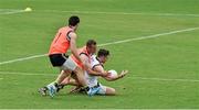 15 November 2014; Ireland's Cathal Cregg is tackled by Neil McGee and Mattie Donnelly during International Rules squad training ahead of their International Rules Series warm up game against VFL All Stars on Sunday 16th. Ireland International Rules Squad Training, Sandringham VFL Ground, Melbourne, Victoria, Australia. Picture credit: Ray McManus / SPORTSFILE