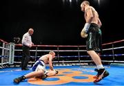 15 November 2014; John Joe Nevin, right, knocks down Jack Heath in the first round of their featherweight bout. Return of The Mack, 3Arena, Dublin. Picture credit: Ramsey Cardy / SPORTSFILE
