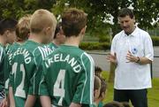 25 June 2006; Former Republic of Ireland star and 'Godfather' to this year's Irish team, Denis Irwin, speaking to the talented young Cherry Orchard team who will travel to Lyon to represent Ireland in less than a week's time at the Danone Nations Cup World Final. Irwin took the young team under his wing one last time to pass on his expertise and vast knowledge of International soccer. AUL Complex, Clonshaugh, Dublin. Picture credit: Brendan Moran / SPORTSFILE