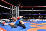 15 November 2014; Anthony Fitzgerald lies on the canvas after being knocked out during the first round of his  middleweight bout against Gary 'Spike' O'Sullivan. Return of The Mack, 3Arena, Dublin.  Picture credit: Ramsey Cardy / SPORTSFILE