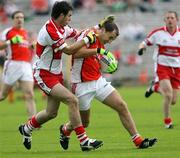 8 July 2007; Paddy McKeever, Armagh, in action against Liam Hinphey, Derry. Bank of Ireland All-Ireland Senior Football Championship Qualifier, Round 1, Armagh v Derry, St Tighearnach's Park, Clones, Co. Monaghan. Picture credit: Oliver McVeigh / SPORTSFILE