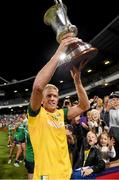 22 November 2014; The Australia goalkeeper Dustin Fletcher, wearing an Irish shirt, carries the Cormac McAnallan Cup to the dressing room. Virgin Australia International Rules Series, Australia v Ireland. Paterson's Stadium, Perth, Australia. Picture credit: Ray McManus / SPORTSFILE