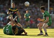 22 November 2014; Luke Breust, Australia, is tackled by  Neil McGee, Ireland, as Lee Keegan moves in to assist. Virgin Australia International Rules Series, Australia v Ireland. Paterson's Stadium, Perth, Australia. Picture credit: Ray McManus / SPORTSFILE