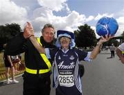 14 July 2007; Former World 5,000 metre champion Eamonn Coghlan with Brian Tyrrell, from Popintree, Dublin, who traditionally wins the 'fancy dress' section. Brian is all decked out in the Dublin colours to mark the Leinster Final. adidas Irish Runner Challenge. Pheonix Park, Dublin. Picture credit: Ray McManus / SPORTSFILE