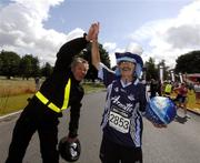 14 July 2007; Former World 5,000 metre champion Eamonn Coghlan with Brian Tyrrell, from Popintree, Dublin, who traditionally wins the 'fancy dress' section. Brian is all decked out in the Dublin colours to mark the Leinster Final. adidas Irish Runner Challenge. Pheonix Park, Dublin. Picture credit: Ray McManus / SPORTSFILE